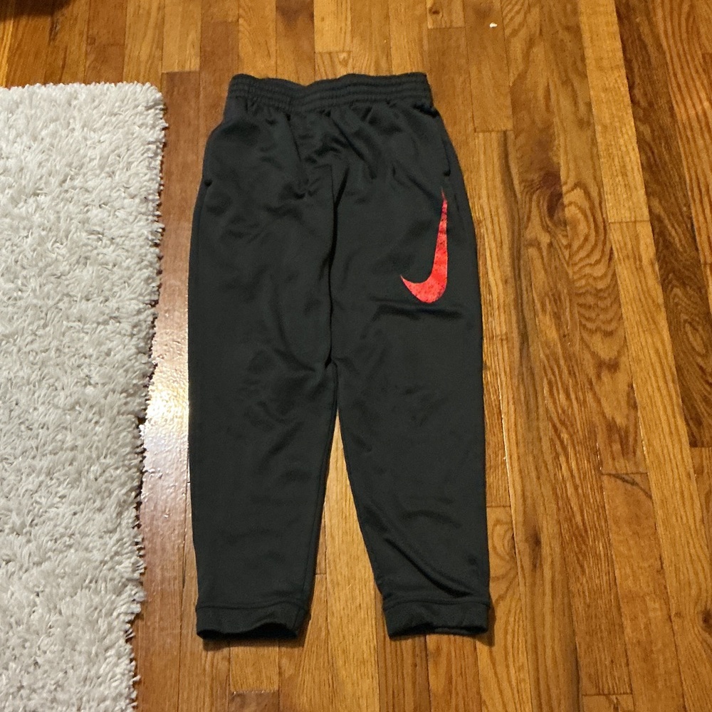 Nike Kids Charcoal Joggers with Bright Red Logo